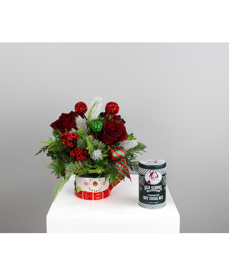 Celebrate the season with Frosty the Snowman, a cheerful holiday arrangement that’s sure to warm hearts and spread smiles.