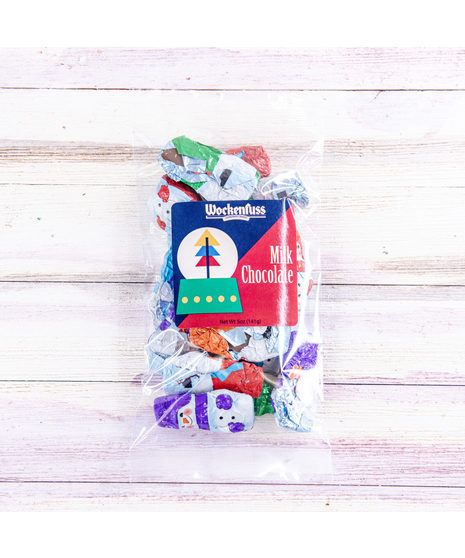 Bite sized solid milk chocolate Snowmen, wrapped in foil, featuring assorted designs. Great for party favors , candy jars or Christmas stockings!