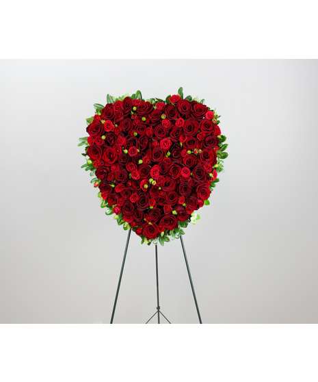 This Bleeding Heart Standing Spray is a profound expression of love, sympathy, and remembrance.