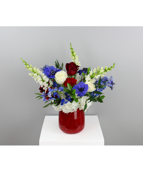 Bursting with color and festive charm, Fireworks is a striking floral arrangement inspired by the beauty of a summer sky illuminated with celebration.