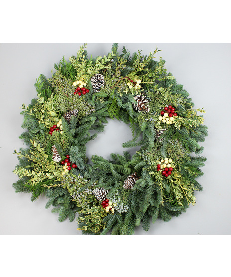Bring timeless holiday warmth to your home with the Comfort & Joy Wreath.