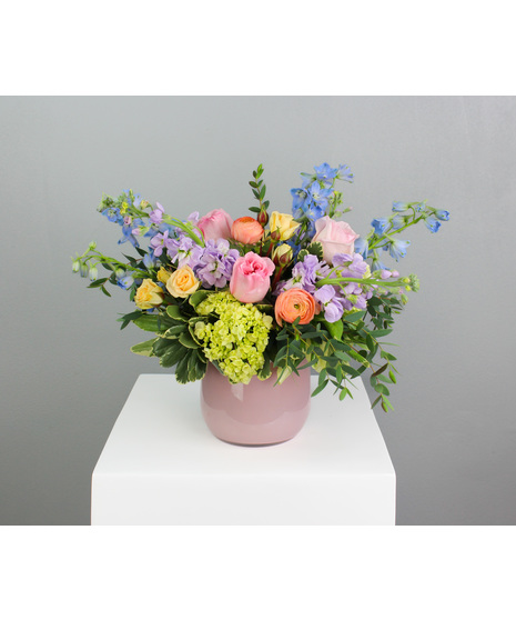It’s a dreamy, whimsical arrangement that’s perfect for any occasion where grace and beauty are desired.