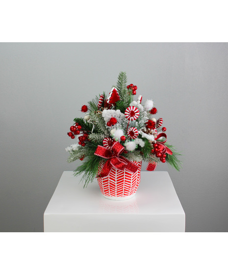 The Peppermint Candy Silk Arrangement is a festive and fun holiday accent that brings a sweet touch of Christmas cheer.