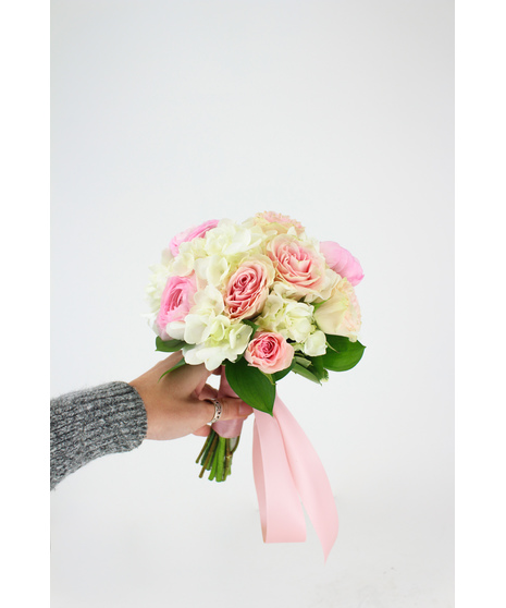 An elegant and sweet bouquet of spray roses, ranunculus, hydrangea and greenery. Perfect for prom, homecoming, and all dances!