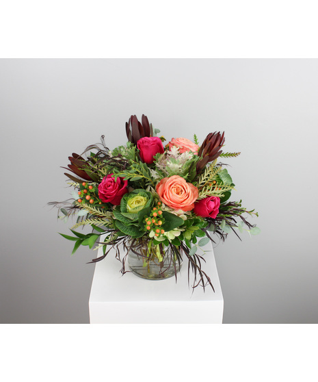 Embrace the vibrant hues of autumn with Cabbage Patch, a striking fall arrangement that brings the beauty of the season indoors.