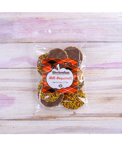  Pure, rich semi milk chocolate about the size and shape of a half-dollar, studded with autumn colored candy seeds for that satisfying crunch in your mouth!