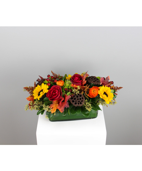 Tuscan Sun is a warm, radiant long and low centerpiece that brings the golden charm of autumn straight to the table.