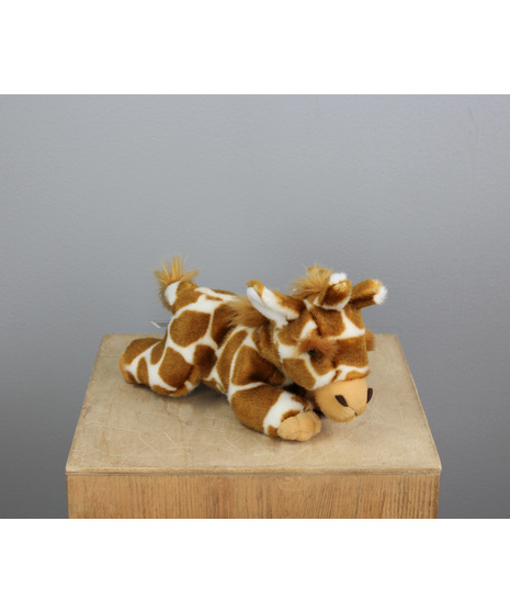 Greta the Giraffe is a sweet 8-inch plush friend, peacefully nestled in a cozy laying-down pose that’s perfect for snuggling or decorating your favorite spot.