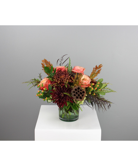 Spiced Harvest is a warm and inviting fall arrangement that captures the essence of the season.