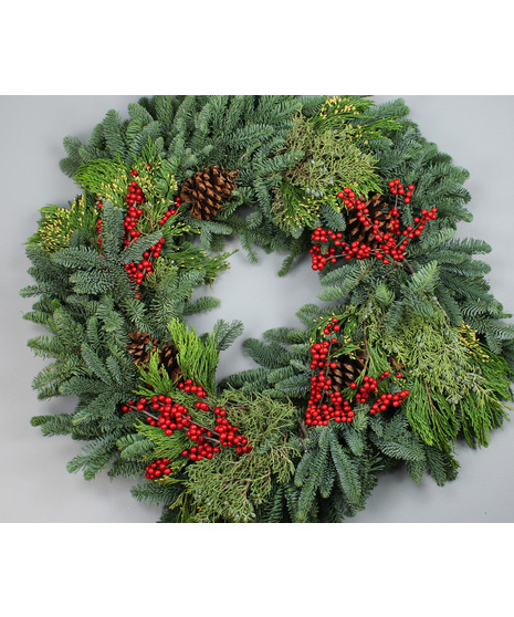 Celebrate the season with our Christmas Traditions Wreath, a timeless blend of natural evergreens and festive accents. 