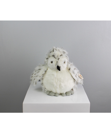 Orlaya the Owl is a stunning 9-inch plush barn owl, wrapped in soft, snowy white feathers with delicate touches of cream and gray that give her a gentle, mystical glow.