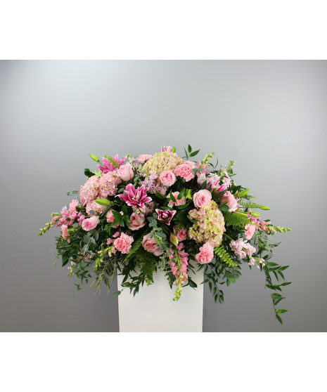 Endless Adoration Premium Casket Spray is a stunning expression of everlasting love and admiration