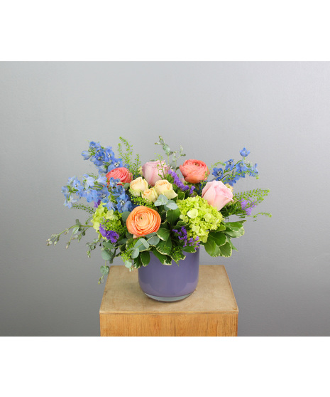 It’s a dreamy, whimsical arrangement that’s perfect for any occasion where grace and beauty are desired.