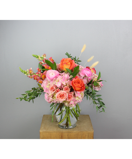 Experience the vibrant and refreshing allure of our Tangerine Spritz arrangement